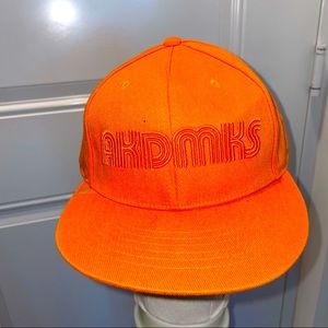Orange fitted akdmks hat